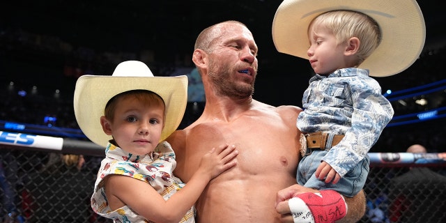 Donald Cerrone and sons in the Octagon during the UFC 276 event at T-Mobile Arena on July 02, 2022 in Las Vegas, Nevada. (Photo by Jeff Bottari/Zuffa LLC)