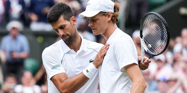 Novak Djokovic (L) of Serbia greets Jannik Sinner of Italy after their men's singles quarter-finals during day nine of the 2022 Wimbledon Championships at the All England Lawn Tennis and Croquet Club on July 5, 2022 in London, England. 