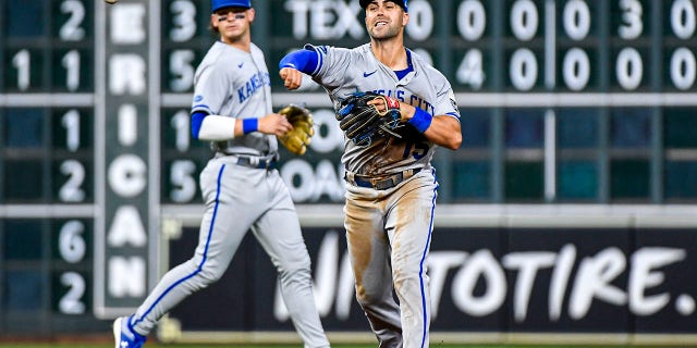 Whit Merrifield #15 of the Kansas City Royals fields a ball in the 5th inning against the Houston Astros at Minute Maid Park on July 05, 2022 in Houston, Texas.