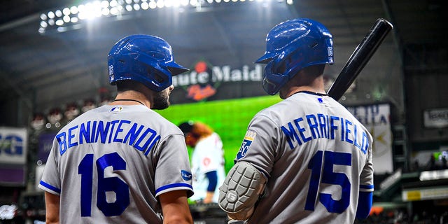 Andrew Benintendi of the Kansas City Royals talks to teammate Whit Merrifield during a game against the Houston Astros at Minute Maid Park on July 6, 2022 in Houston. 