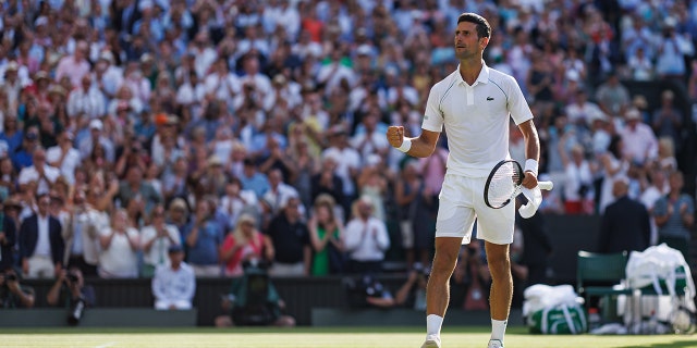 Novak Djokovic of Serbia celebrates his victory over Cameron Norrie of Great Britain in the men's singles semifinals of Wimbledon 2022 at the All England Lawn Tennis and Croquet Club July 8, 2022, in London. 