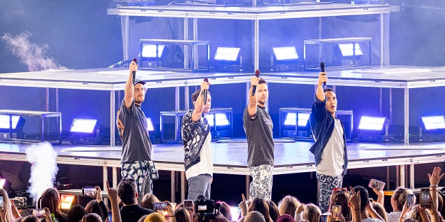 Kendall Schmidt, Logan Henderson, James Maslow and Carlos PenaVega of Big Time Rush perform at Michigan Lottery Amphitheatre on July 10, 2022, in Sterling Heights, Michigan.