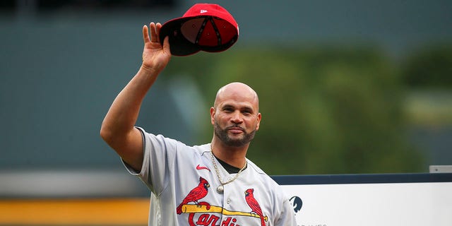 Albert Pujols, #5 of the St. Louis Cardinals, is honored before a game against the Atlanta Braves at Truist Park on July 7, 2022 in Atlanta, Georgia. 