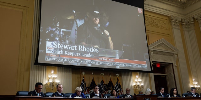 Oath Keepers founder Stewart Rhodes appears on a video screen above members of the Select Committee to Investigate the January 6th Attack on the U.S. Capitol during the seventh hearing on July 12, 2022, in Washington, DC.