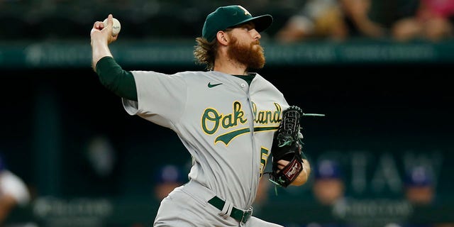 Paul Blackburn #58 of the Oakland Athletics throws a pitch in the first inning against the Texas Rangers at Globe Life Field on July 13, 2022 in Arlington, Texas. 