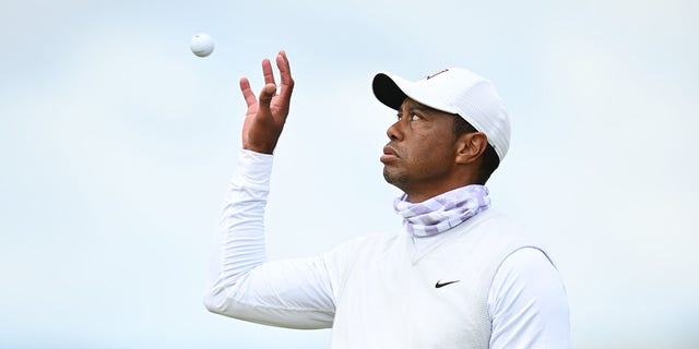 Tiger Woods catches a ball during the 150th Open at St Andrews Old Course on July 15, 2022 in St Andrews, Scotland. 