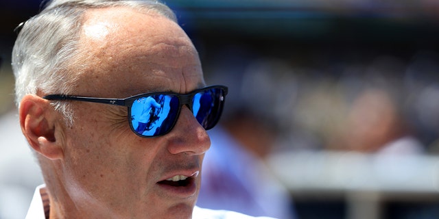 Manfred watches the Gatorade All-Star Workout Day at Dodger Stadium on Monday, July 18, 2022, in Los Angeles.