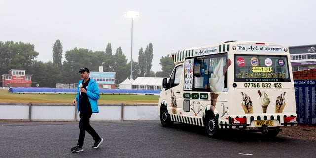DERBY, ENGLAND - JULY 21: Spectators buy Ice Cream's from an Ice Cream Van as rain stops play during the LV= Insurance County Championship match between Derbyshire and Nottinghamshire at The Incora County Ground on July 21, 2022 in Derby, England. (Photo by George Wood/Getty Images)