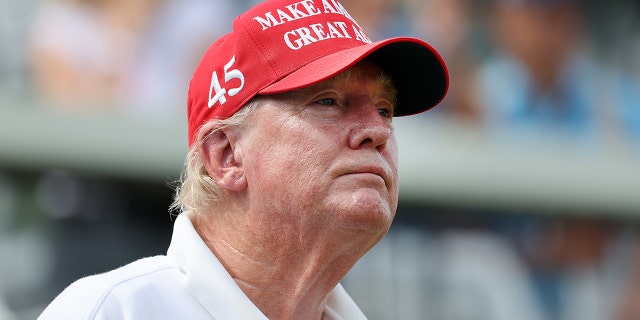 Donald Trump watches the LIV Golf pro-am