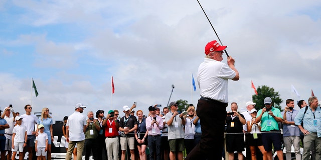 Former U.S. President Donald Trump watches his shot from the first tee during the pro-am prior to the LIV Golf Invitational - Bedminster at Trump National Golf Club Bedminster on July 28, 2022 in Bedminster, New Jersey.