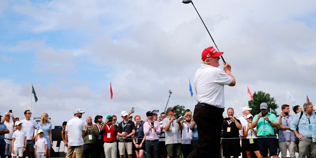 Donald Trump tees off at the LIV Golf pro-am