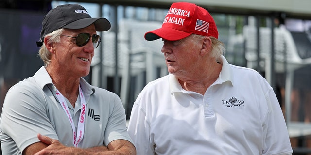 Greg Norman, CEO and commissioner of LIV Golf, talks with former US President Trump on the first tee during the pro-am prior to the LIV Golf Invitational - Bedminster at Trump National Golf Club Bedminster on July 28, 2022 in Bedminster, New Jersey. 