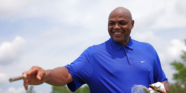Charles Barkley holding a cigar on the 7th hole at the LIV Golf Invitational - Pro-Am in front of Bedminster at Trump National Golf Club, Bedminster, NJ, July 28, 2022.