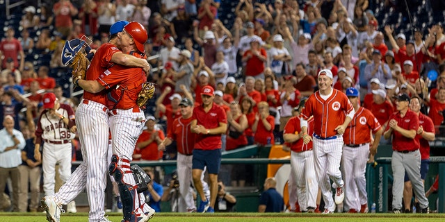 Rep. August Flueger (R-Texas) and Rep. Rodney Davis (Rep.-Texas) after a congressional baseball game for charity at Nationals Park, Washington, DC, July 28, 2022. Republicans (Illinois) celebrate. The annual bipartisan game was first played in 1909.