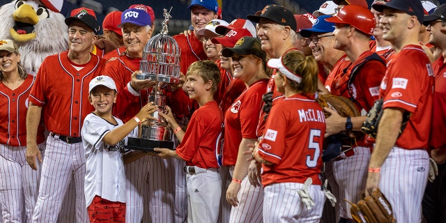 Several players celebrating with a trophy