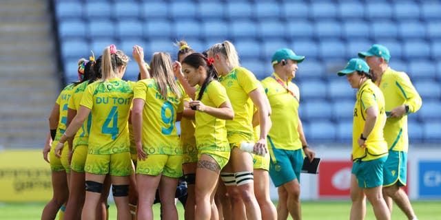 Team Australia form a huddle during the Women's Rugby 7s Pool B match between Team Australia and Team South Africa on day one of the Birmingham 2022 Commonwealth Games at Coventry Stadium.