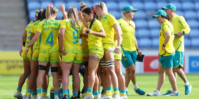 Team Australia form a huddle during the Women's Rugby Sevens Pool B match between Team Australia and Team South Africa on day one of the Birmingham 2022 Commonwealth Games at Coventry Stadium.