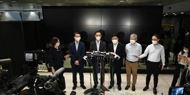 Kevin Young (third from left), Minister of Culture, Sports and Tourism in the Hong Kong Special Administrative Region government, speaks to the media after inspecting the Hong Kong Coliseum on July 29, 2022 in Hong Kong, China.
