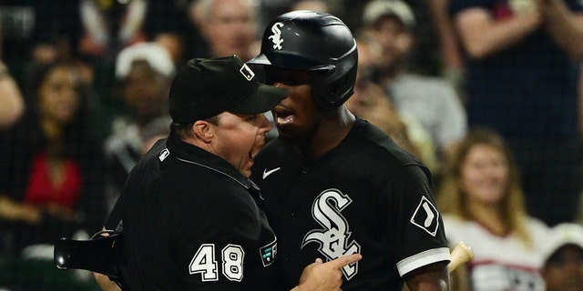 Tim Anderson of the Chicago White Sox, right, is ejected from the game after making contact with umpire Nick Mahrley (48) in the seventh inning against the Oakland Athletics at Guaranteed Rate Field, July 29, 2022, in Chicago, Illinois.