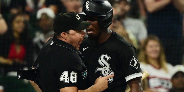 Tim Anderson of the Chicago White Sox, right, is ejected from a game after making contact with umpire Nick Mahrley (48) in the seventh inning against the Oakland Athletics at Guaranteed Rate Field July 29, 2022, in Chicago.