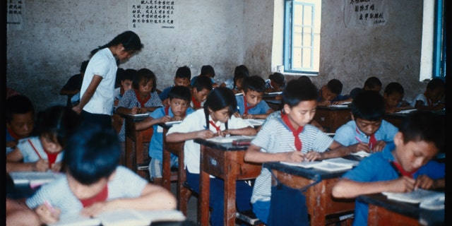 Red China guards junior grade inside school red tie for "red" communist.