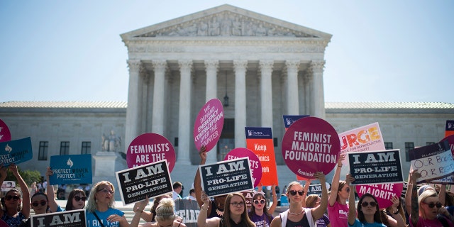 Pro-choice and pro-life demonstrators rally outside of the U.S. Supreme Court on Monday morning, June 20, 2016. 