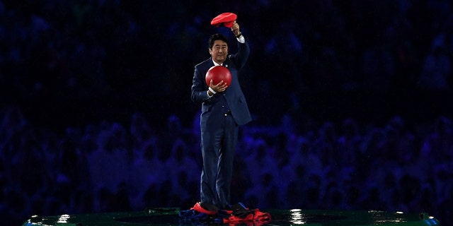 Japan Prime Minister Shinzo Abe appears during the 'Love Sport Tokyo 2020' segment during the Closing Ceremony on Day 16 of the Rio 2016 Olympic Games at Maracana Stadium on August 21, 2016 in Rio de Janeiro, Brazil.  