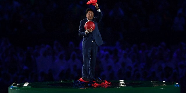 Japan Prime Minister Shinzo Abe appears during the 'Love Sport Tokyo 2020' segment during the Closing Ceremony on Day 16 of the Rio 2016 Olympic Games at Maracana Stadium on August 21, 2016 in Rio de Janeiro, Brazil.