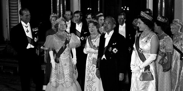Foreground left: The Duke of Edinburgh, The Queen Mother, Empress Nagako, Emperor Hirohito and Queen Elizabeth.  In the background of the royal group, from left to right, the Duke and Duchess of Kent, the Prince of Wales, Princess Anne, Lord Snowdon, Princess Margaret (behind the Queen), and, far right, Princess Alice, Countess of Athlone.  The Queen wears the Collar and Grand Cordon of the Supreme Order of the Chrysanthemum, Japan's highest decoration;  The Emperor wears the Order of the Garter.  (Photo by PA Images via Getty Images)