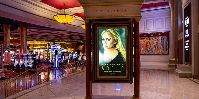 A promotional billboard touting the upcoming concerts by singer Adele is viewed inside Caesars Palace Hotel & Casino on Jan. 9, 2022, in Las Vegas, Nevada. The shows would be canceled by the star.