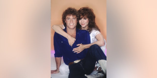 Andy Gibb and Victoria Principal pose in 1981 in Los Angeles, California.