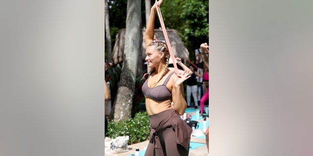 Camille Kostek said that she is a big fan of resistance bands to work out on the go.