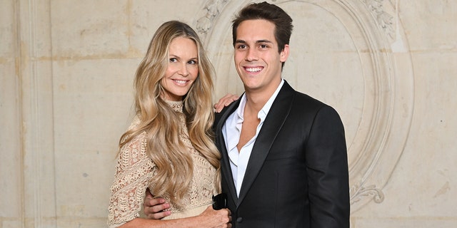 Elle Macpherson and son Flynn Busson attend the Christian Dior Haute Couture Fall Winter 2022/2023 show as part of Paris Fashion Week on July 04, 2022, in Paris, France.