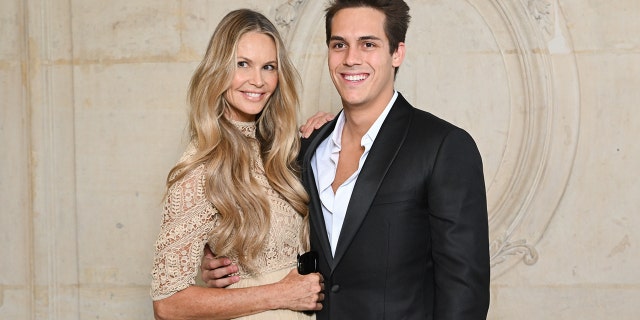Elle Macpherson and son Flynn Busson attend the Christian Dior Haute Couture Fall Winter 2022/2023 show as part of Paris Fashion Week on July 04, 2022, in Paris, France.