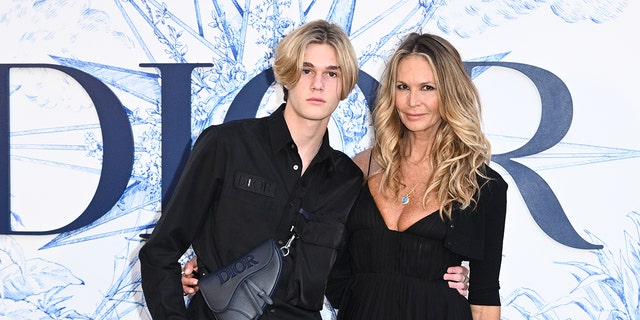 Elle Macpherson and son Cy Busson attend ‘Crucero Collection’ fashion show presentation by Dior at Plaza de España on June 16, 2022, in Seville, Spain. 