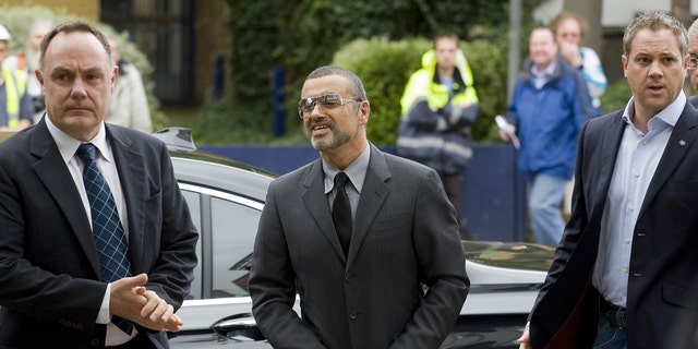 George Michael arrives for sentencing on driving under the influence charges.