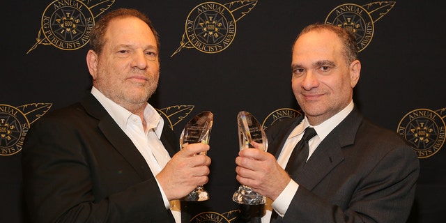 Harvey Weinstein (L) and Bob Weinstein pose with the Motion Picture Showmanship Award backstage at the 52nd Annual ICG Publicists Awards at The Beverly Hilton Hotel on February 20, 2015, in Beverly Hills, California. 