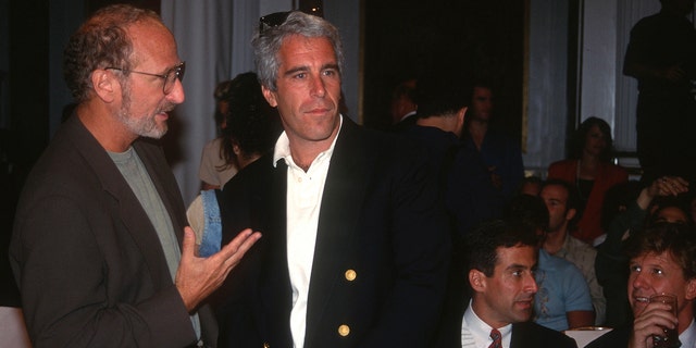 A guest and Jeffrey Epstein attend the Victoria's Secret Fashion Show at the Plaza Hotel on August 1, 1995, in New York City.