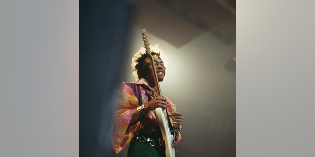 Jimi Hendrix (1942-1970) performs live on stage playing a white Fender Stratocaster guitar with The Jimi Hendrix Experience at the Royal Albert Hall in London Feb. 24, 1969.