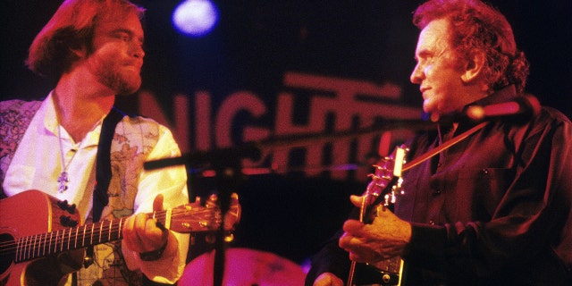 Johnny Cash performs on stage with his son John Carter Cash (L) in Rotterdam, Netherlands, circa 1994.