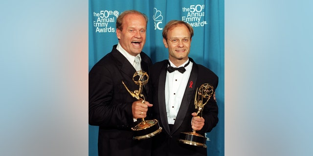Kelsey Grammer and David Hyde Pierce hold their Emmys for "Frasier" at the 50th Annual Primetime Emmy Awards ceremony in Los Angeles.