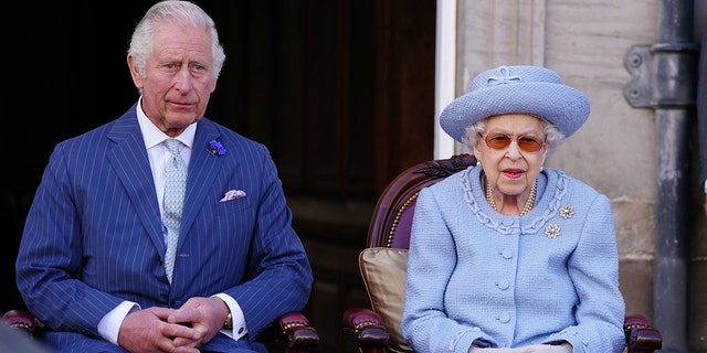 Prince Charles, Prince of Wales, known as the Duke of Rothesay when in Scotland, and Queen Elizabeth II attending the Queen's Body Guard for Scotland Reddendo Parade in the gardens of the Palace of Holyroodhouse, Edinburgh, Scotland, June 30, 2022. 
