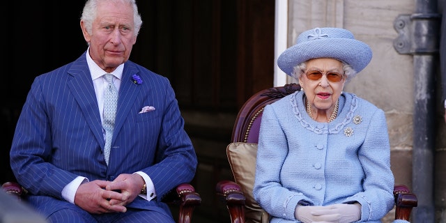 Prince Charles, Prince of Wales, known as the Duke of Rothesay when in Scotland, and Queen Elizabeth II attending the Queen's Body Guard for Scotland Reddendo Parade in the gardens of the Palace of Holyroodhouse, Edinburgh, Scotland, June 30, 2022.