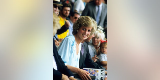 Princess Diana watches from the crowd during the Live Aid concert at Wembley Stadium in London on July 13, 1985. The concert raised funds for famine relief in Ethiopia.