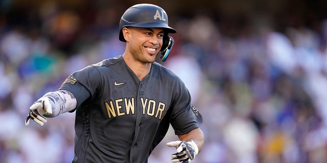 Giancarlo Stanton of the New York Yankees' American League points to a dugout after connecting to a two-run home run in the fourth inning of the MLB All-Star Baseball National League match in Los Angeles on Tuesday, July 19, 2022. Angeles. 