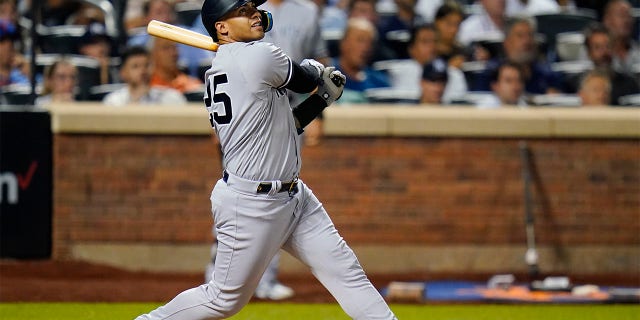 New York Yankees' Gleyber Torres watches his two-run home run against the New York Mets during the eighth inning of a baseball game Wednesday, July 27, 2022, in New York.