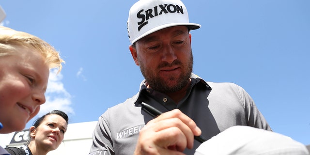 Northern Ireland's Graeme McDowell of Team Niblicks GC, signs a hat for a fan, during day three of the LIV Golf Invitational Series at the Centurion Club, Hertfordshire. Picture date: Saturday June 11, 2022.