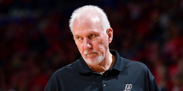 San Antonio Spurs head coach Greg Popovich looks on during a game against the New Orleans Pelicans during the 2022 Play-In Tournament at the Smoothie King Center in New Orleans, Louisiana, on April 13, 2022. 