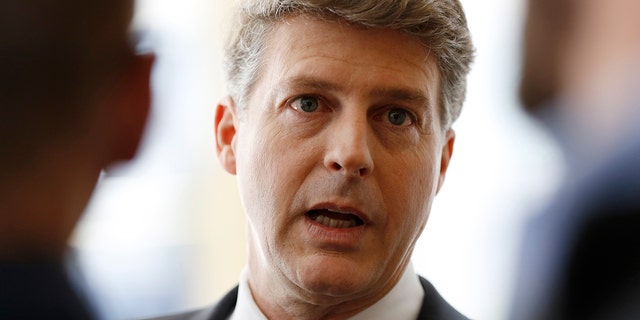 New York Yankees owner Hal Steinbrenner stops to talk to the media before attending a meeting of Major League Baseball's executive committee May 18, 2016, in New York.