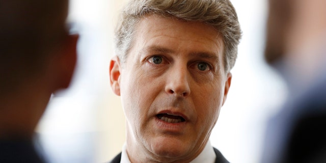 New York Yankees owner Hal Steinbrenner stops to talk to the media before attending a meeting of Major League Baseball's executive committee May 18, 2016, in New York.